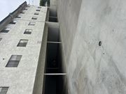 Sylmar multi-family for rent - A concrete building with a lot of windows.