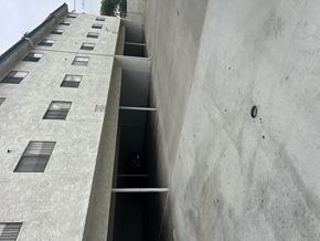 Sylmar multi-family for rent - A concrete building with a lot of windows.