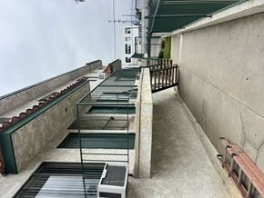 Sylmar multi-family for rent - A concrete staircase with metal railings and steps leading down to a lower level.