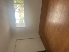 North Hills multi-family for rent - A room with a window and wooden walls.