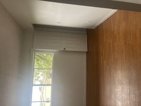 North Hills multi-family for rent - A room with a window and wooden walls.