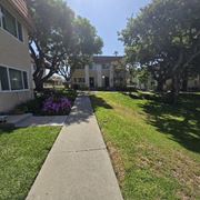 San Ysidro multi-family for rent - A sunny day at a residential area with a sidewalk and green grass.