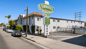 Bellflower multi-family for rent - A sign for Townhouse in Brea, California is shown in front of a building.