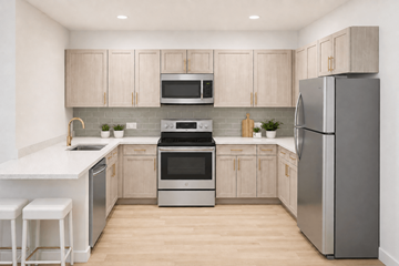 Trenton apartment for rent - A modern kitchen with wooden cabinets and stainless steel appliances.