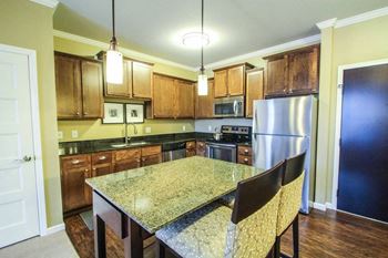 Victoria park apartments kitchen with designer cabinetry & granite countertops