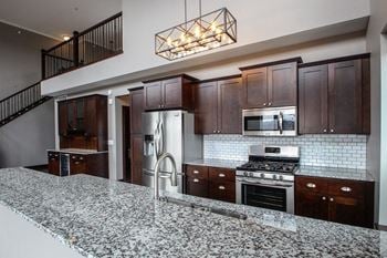 V2 apartments penthouse kitchen with designer cabinetry and upgraded finishes