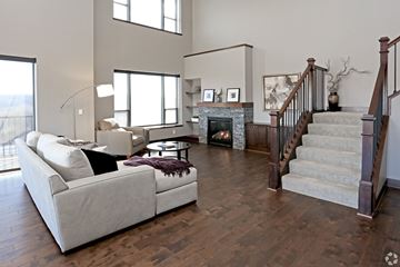 St. Paul apartment for rent - A living room with a white couch and a fireplace.
