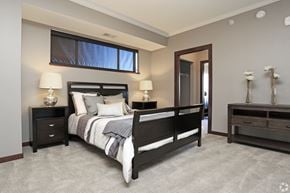 St. Paul apartment for rent - Bedroom with dark wood furniture and large mirror at Victoria Park and V2 Apartments, Minnesota
