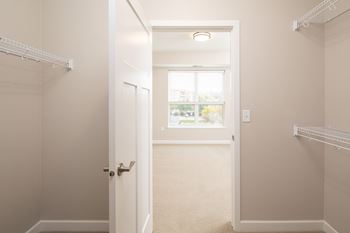A walk in closet in a 555 waverly unit