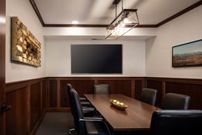 St. Paul apartment for rent - a conference room with a table and chairs and a tv on the wall  at Victoria Park and V2 Apartments, St. Paul, 55102