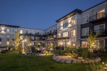 Courtyard with fire pit and landscaped seating area