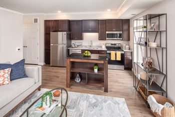 A kitchen and living room in a 555 waverly unit