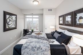 Burnsville apartment for rent - a bedroom with a large bed at The Gallery Apartments, Minnesota