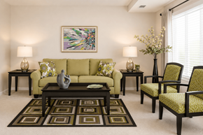 Essex apartment for rent - A living room with a green couch, two end tables, a coffee table, and a painting on the wall.