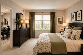 Essex apartment for rent - A bedroom with a large bed and a window with curtains.