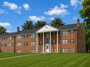 Essex apartment for rent - A red brick building with a white door and windows.