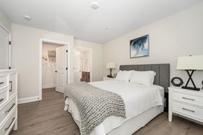 Easton apartment for rent - A bedroom with a large bed and a painting on the wall at The Promenade at Easton Apartments, Easton, 21601