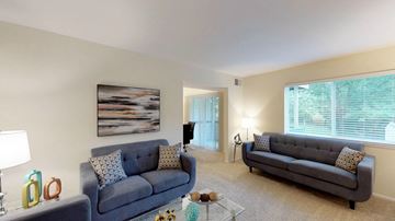 Annapolis apartment for rent - A living room with two grey couches and a painting on the wall.