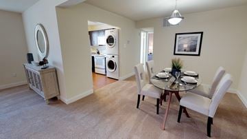 Towson apartment for rent - a living room with blue couches and a table