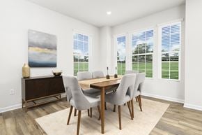 Halethorpe townhouse for rent - A dining room with a wooden table and chairs. at Forge Overlook, Halethorpe