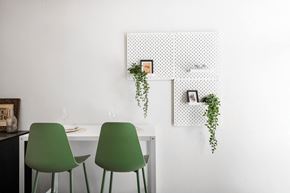 Sacramento apartment for rent - a room with green chairs and a white table