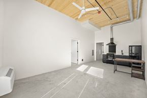Sacramento apartment for rent - a living room with white walls and a wooden ceiling