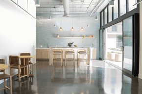 Davis apartment for rent - A modern dining area with wooden chairs and tables.