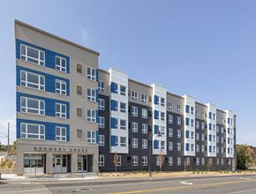 Duluth apartment for rent - A multi-story building with the name Brewery Creek on the front.