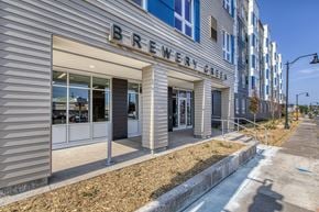 Duluth apartment for rent - A building with a sign that says Brewery Green.