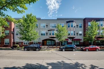 Des Moines townhouse for rent - A black car is parked in front of a building.