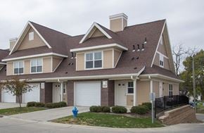 Waterloo townhouse for rent - A house with a brown roof and a white garage door.
