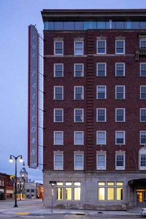 Marshalltown apartment for rent - A tall red brick building with a sign that says "Theatricorn" on it.
