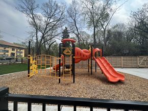 St. Paul apartment for rent - a playground with a slide and other toys in a park