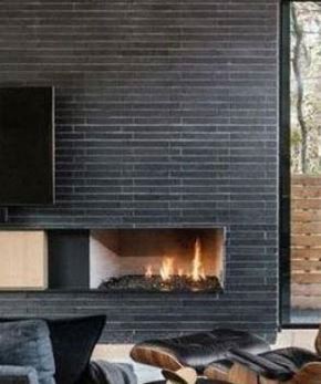 Minneapolis apartment for rent - A modern fireplace with a black frame and a fire burning inside.