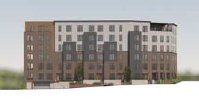 Minneapolis apartment for rent - A large, modern apartment building with multiple balconies and a mix of window sizes.