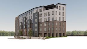 Minneapolis apartment for rent - A modern multi-story apartment building with a mix of dark and light brown balconies.