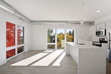 Minneapolis apartment for rent - A kitchen with white cabinets and a white counter top.