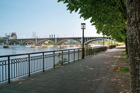 Minneapolis apartment for rent - A bridge over a river with a walkway on the side.