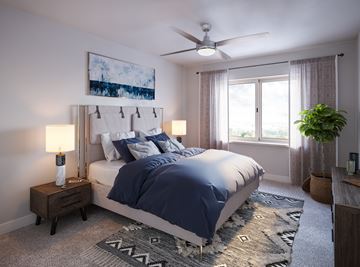 Papillion apartment for rent - A bedroom with a large bed and a ceiling fan.