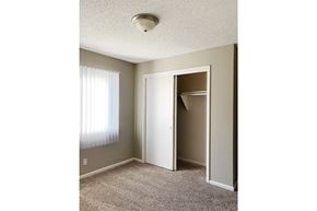 Bellevue apartment for rent - an empty bedroom with a closet and a window