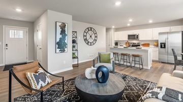 Gretna townhouse for rent - A modern living room with a large coffee table and a bar area.