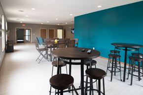 Lincoln apartment for rent - a dining room with tables and chairs and a blue wall