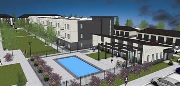 Omaha townhouse for rent - A modern apartment complex with a swimming pool in the courtyard.