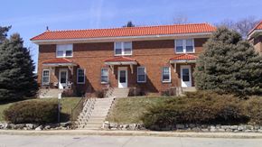 Omaha apartment for rent - a red brick building with stairs in front of it