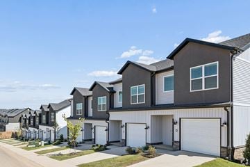 Springdale townhouse for rent - A row of modern houses with garages.