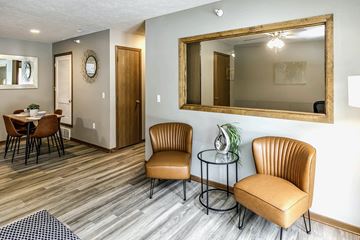 La Vista apartment for rent - a living room with two chairs and a mirror