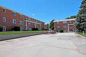Omaha apartment for rent - an empty parking lot in front of an apartment building