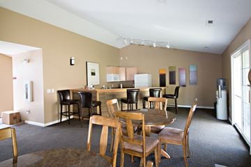 Council Bluffs apartment for rent - a living room with a dining table and chairs and a kitchen