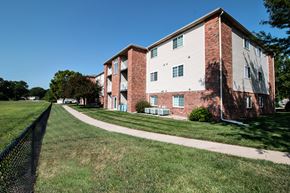 Blair apartment for rent - an apartment building on the side of a sidewalk