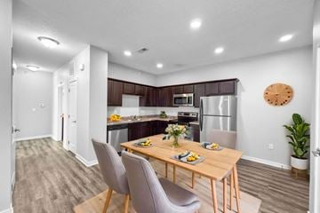 Johnston apartment for rent - A modern kitchen with a dining table set for two.